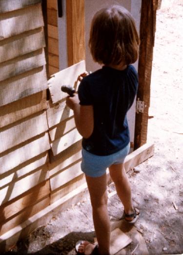 Nailing a rectangular board to the side of the fort