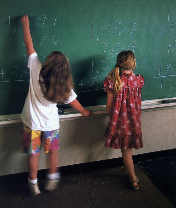 Children adding long column of big numbers using Addition Facts Algorithm